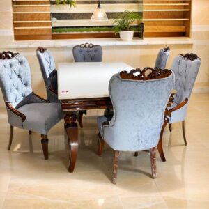 dining table set with onix top and upholstered chairs in teak wood frame