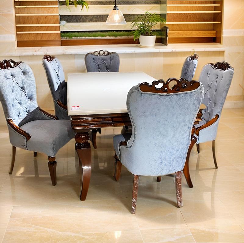 dining table set with onix top and upholstered chairs in teak wood frame