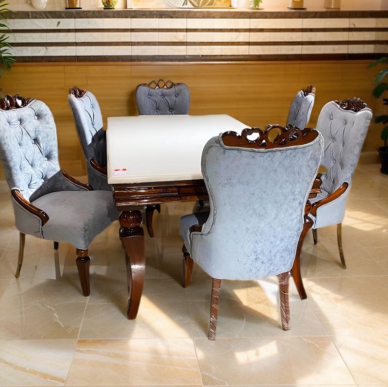 dining table set with onix top and upholstered chairs in teak wood frame